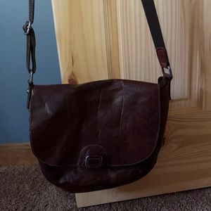 A cross body purse brown leather medium size
